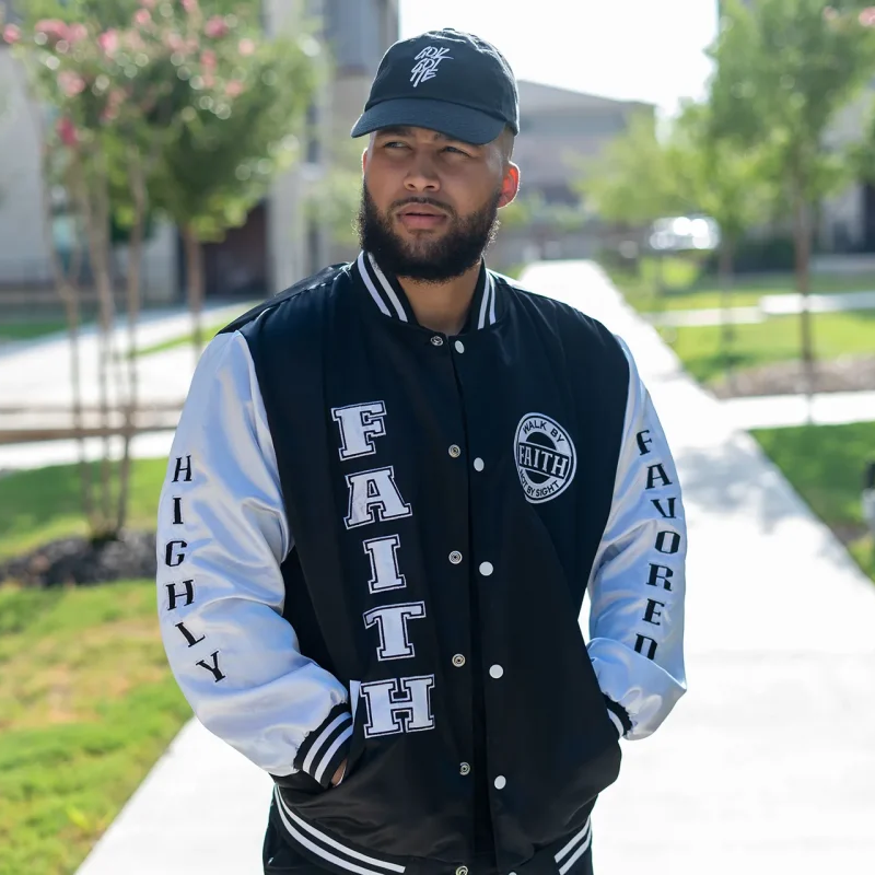 Model Wearing Black And White Christian Varsity Jacket